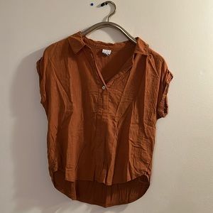 Orange blouse.